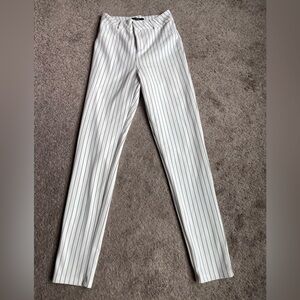 White pants with thin black pin stripes